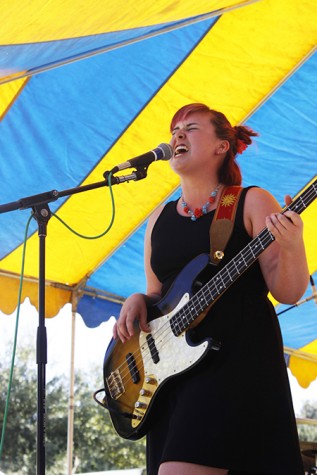 Lead singer and bassist, Emma Simpson, sang at Chalk It Up's 25th annual art festival on Labor Day weekend in Fremont park, downtown Sacramento. Simpson was an expressive performer and interacted with her fellow band members and audience members.