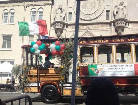 A trolley representing the San Francisco Italian Athletic Club passes in front of Saints Peter and Paul Catholic Church in San Francisco during preparations for a parade commemorating Columbus Day on Oct. 13, 2013. (Photo by John Ferrannini)