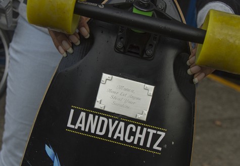 Monea Mitchell's replacement skateboard, given to her by her mother, is inscribed 'Never Let Anyone Steal Your Sunshine' (Photo by John Ferrannini).