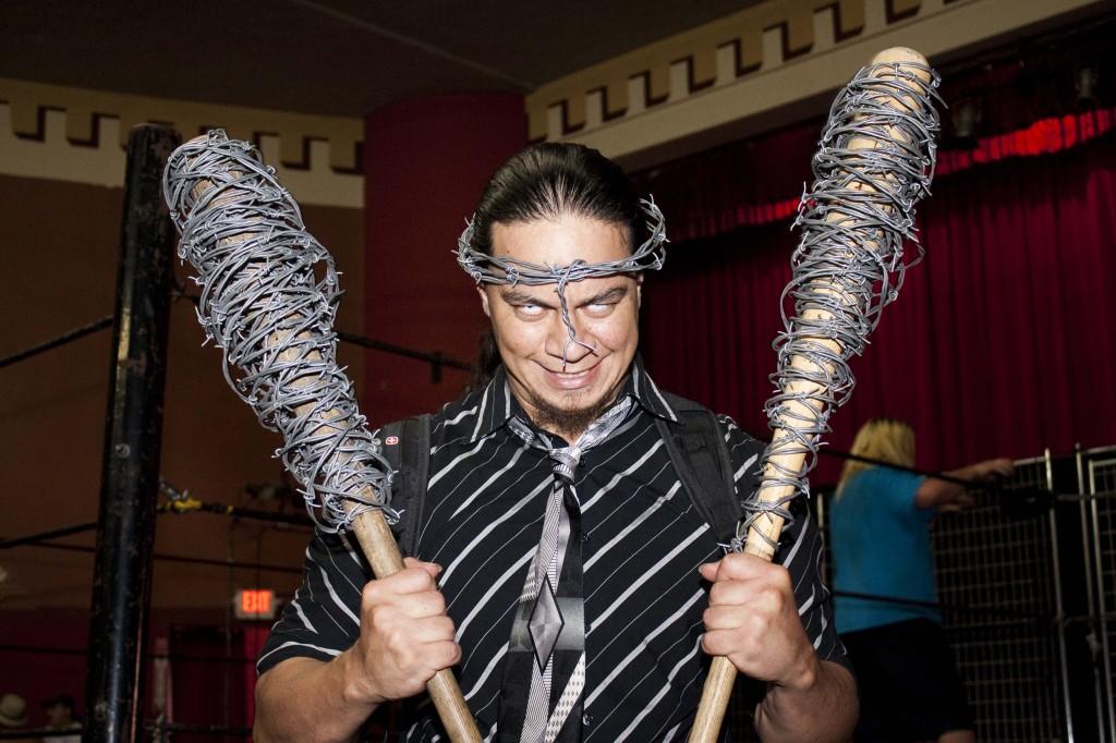 Ron Ruffio, a professional wrestler for the TWF, holds his bats wrapped with barbed wire and wears a barbed wire crown. (Photo by Bryce Fraser)