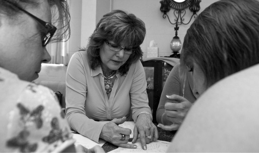 Dana Fraire, an American River College student, teaches tarot to students in her Carmichael office. (Photo by Steven Condemarin)