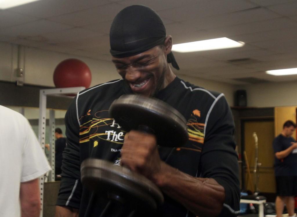 Keith Grimm, a business major, lifting dumbbell weights for his weight training class on Oct. 29. (Photo by Bryce Fraser)