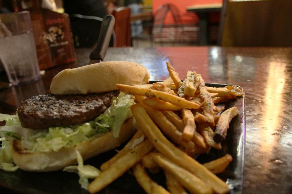 The wild board cafe burger served on a ciabatta roll with a side of garlic fries on Nov. 24. (Photo by Daniel Romandia)