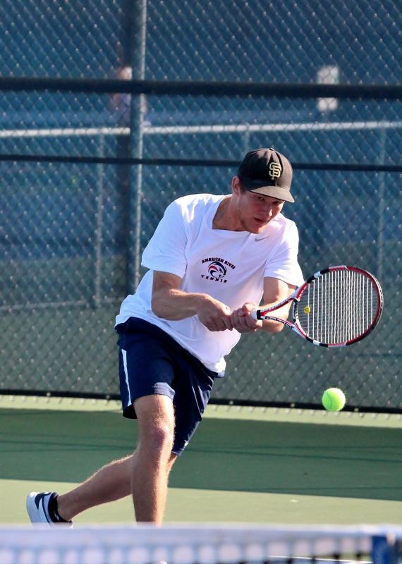 Simba Barratti stretches out to return a serve in his singles match versus Modesto Junior College player Xavier Lopez Feb. 12. Barratti went on to win the match (6-0, 6-0). (Photo by Emily K. Rabasto)