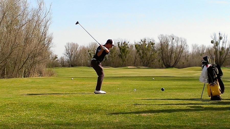 Freshman Colton Passey teeing off at Teal Bend Golf Course in Sacramento on March 9. Passey went on to finish the match shooting an 80.