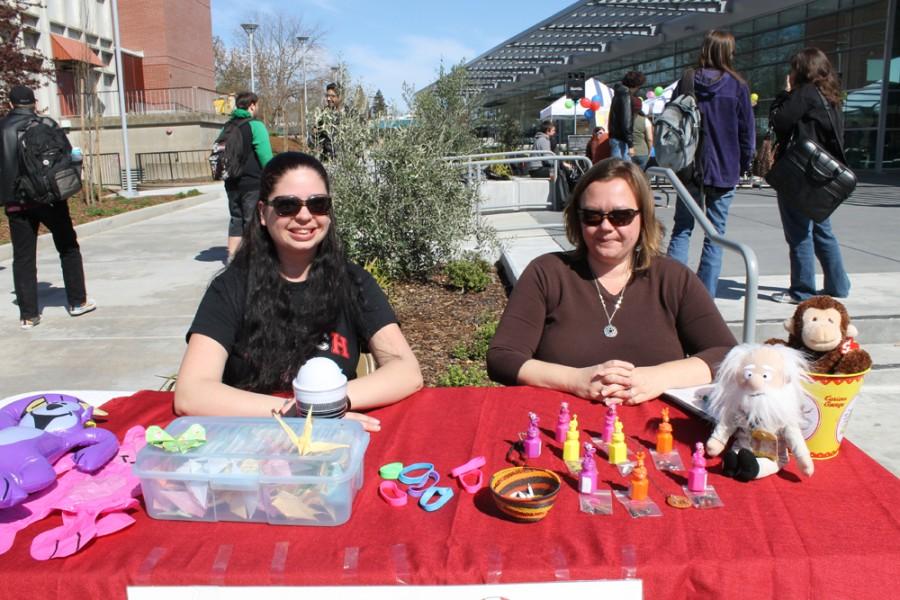 Two participants running a booth during Club Day.