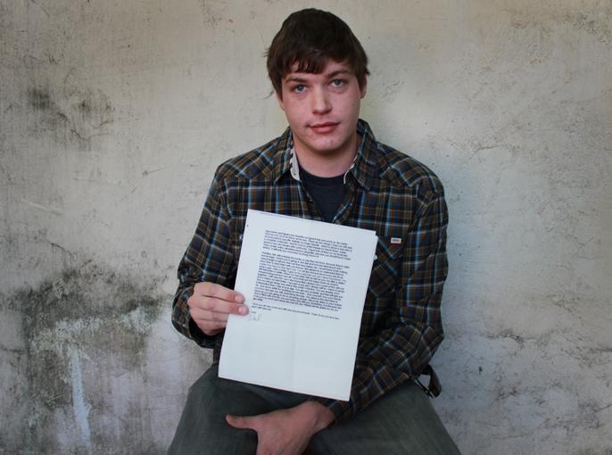 Eric Webb, 25, holds the suicide note written by  his father, Pulitzer Prize-winning journalist Gary Webb, on Thursday, April 18, 2013. (Photo by Emily K. Rabasto)