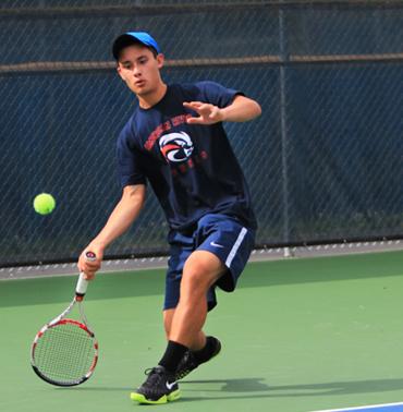 ARC’s Tennis player Kevin Valentine in a match during the Big 8 North Conference Tournament hosted at ARC on April 5 and 6. Photo by Emily K. Rabasto