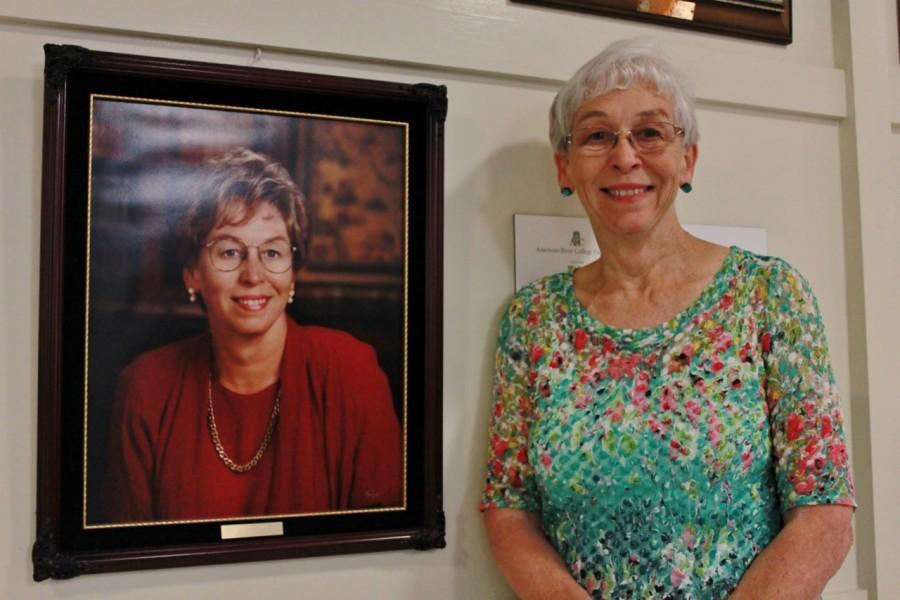 American River College interim president Marie Smith poses next to her previous portrait, taken in 1995, when she first took the position of president almost 18 years ago. (Photo by Emily K. Rabasto)