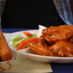 The 10 piece bone-in sweet and spicy buffalo wings are tender and can be ordered with a side of fried zucchini.