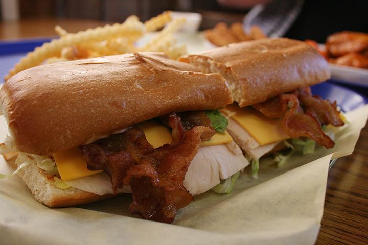 The 9-inch “Railroad” sandwich is inexpensive and layered with freshly fried bacon. (Photo by Alisha Kirby)