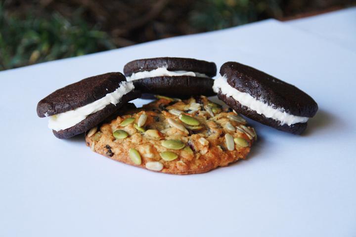 Mexican Oreos are soft, cinnamon-spiced Mexican Chocolate wafers with buttercream filling, pictured here with a trail mix cookie.