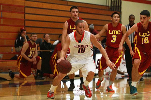 Freshman Isaac Woods outruns a group of Los Medanos College players during their game on Nov. 7. (Photo by Emily K. Rabasto)