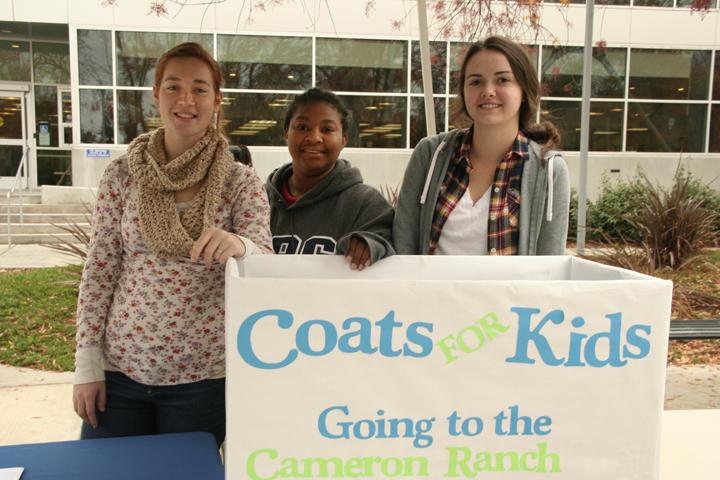 Taylor Zirbel, Faydra Acker and Kayla Reeser, all early education majors, collect coats and canned goods on behalf of the ARC teaching club and Student California Teacher’s Association for Cameron Ranch Elementary School. They will be outside the ARC library all this week from 12 a.m.-4 p.m.