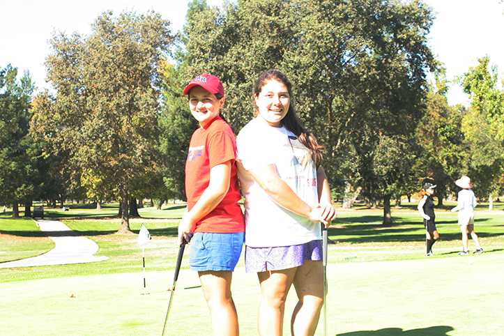 Freshman Gabby Rosales and Sophomore Megan Santo Domingo practicing at Anil Hoffman Golf Course on Oct. 23. Photo by Shedric Allen