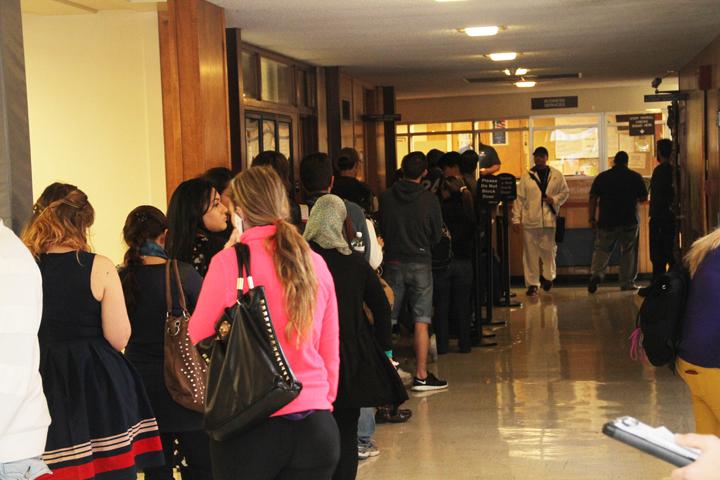 Students wait in line to pay for classes and parking permits on the first day of classes. The line wrapped through the administration building. The best way to avoid the lines is to pay your fees early. (Photo by Brandon Nelson)