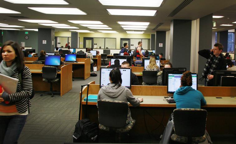 Students using the computers in the first floor of the library.