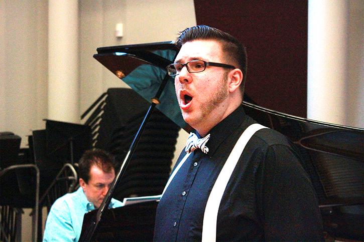 Justin Vaughn practices vocals from the piece “Dalla Sua Pace” by Mozart with Ralph Hughes playing on the piano.