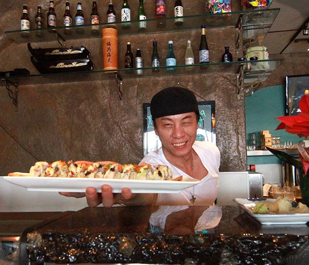 Chef+Jimmy+Kil+serving+up+a+plate+of+dragon+roll.+%28Photo+by+Phillip+Kingsley%29