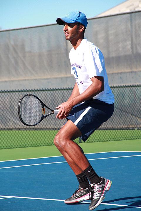 Lovedeep Singh warms up before a singles match at American River College on Friday, March 21, 2014. Singh has known ARC tennis head coach Bo Jabery-Madison since he was a preteen and says he is happy to be taught by him at the college level. Photo by Emily K. Rabasto