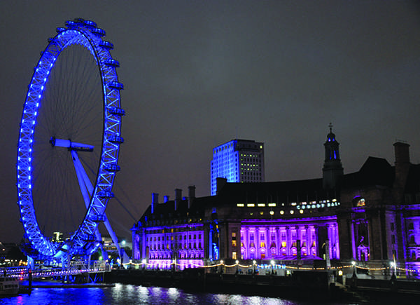 The London Eye, where Barnes and Ice shared their first kiss, is lit up at night.