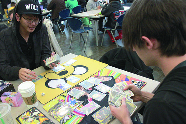 Josep Scalice, left, and Phillip Wingett play ‘Weiss Schwarz,’ a Japanese card game which has become increasingly popular in the United States. By Emily K. Rabasto