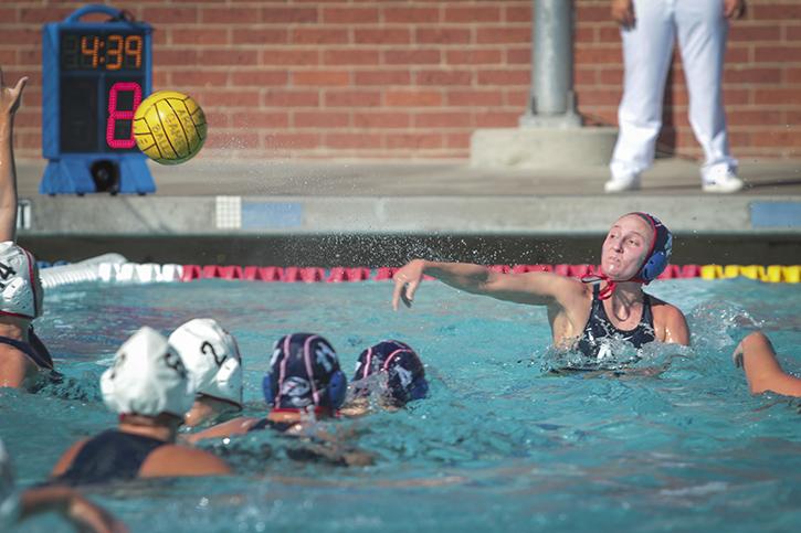 Emily Perry, an American River College sophomore, shoots and scores in a water polo match against Santa Rosa Junior College on Sept. 24. The ARC women’s team won the match in double digits 15-4. (Photo by Emily K. Rabasto)