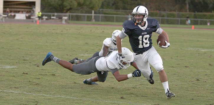 American River College football wide receiver Will McClure dodges a tackle during a game against the College of San Mateo on Oct. 4. (Photo by Emily K. Rabasto)