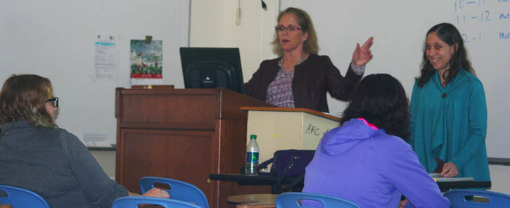 Psychology professor Peg Scott (left) and her assistant Melanie Martinez (right)  inform LWW club members how the year will unfold. 
