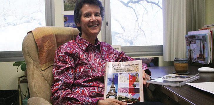 French Professor Deirdre Wolonick, mother of world famous free solo rock climber Alex Honnold, with her most recent publication ‘Je Parle Francais… un peu” a required textbook for her French 400 and 401 classes.  