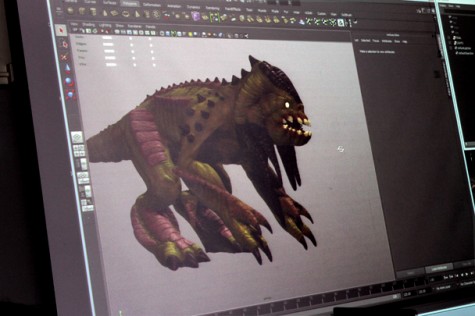 Former animation student Jonathan Camacho, now a professional 3D Animator and modeler, demonstrates for Art New Media students. Here the students watched this geometric shaped animal transform as he pulled out claws and horns on the monster.  He textured the model with available brushes already built it Zbrush and what emerged was a complete 3D monster.
