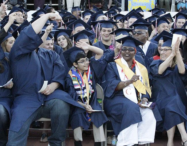 Tanishq Abraham, 11, (center) at American River Colleges graduation last May. Tanishqs sister Tiara, 9, also studies at ARC.