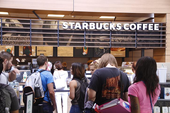 Students brace a long line at the Starbucks in the Student Center on Wednesday. In spite of the opening of a new Peets in the portable village, many students remain brand-loyal to the long-established Starbucks. (Photo by Kameron Schmid)