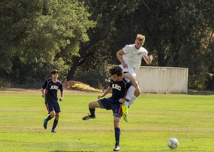 A soccer player from ARC and a player from Feather River College clash as they fight for the possession of the ball in ARCs season opening loss to Feather River College. ARC dominated possession, but couldnt find the back of the net, losing 1-0. (Photo by Joe Padilla)