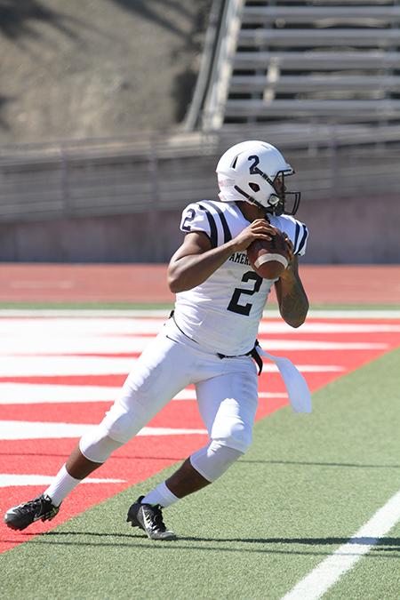 American River College quarterback Jihad Vercher drops back to pass from his own endzone during ARC’s 20-17 win over City College of San Francisco on Sept. 26, 2015. Vercher threw for 280 yards, one touchdown and was 5-8 for 33 yards on the game winning drive. (Photo by Barbara Harvey)