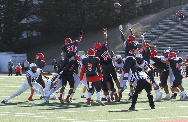 City College of San Francisco’s special teams players attempt to block American River College’s game-winning 25 yard field goal during ARC’s 20-17 win over CCSF on Sept. 26, 2015. The game-ending field goal win was a reversal of the 2014 NorCal Championship game, which ARC lost 17-14 when CCSF scored a field goal during the last minute of the game. (Photo by Barbara Harvey)