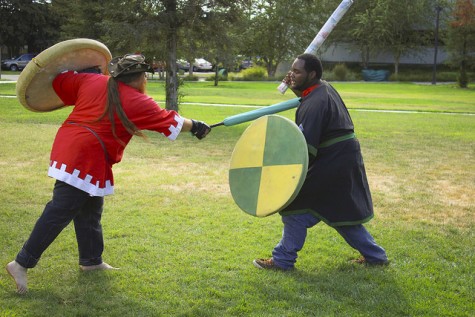 Marcus Birdman, left, a post-grad student and member of the Medieval Fighting Club, spars with Alex Bowie, also a member, during ARC’s first club day of the semester on Sept. 24, 2015. (Photo by Kameron Schmid)