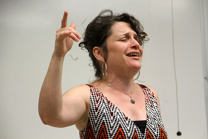 Poet Sandra Garcia Rivera recites her writing during a college hour Tuesday. Garcia talked about how her life decisions influenced her work. (Photo by Lena DoBynes) 