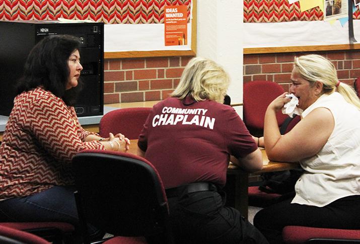 A Sacramento City College counselor and a community chaplain counsel a student grieving on Sept. 4, over the fatal shooting on the campus the day before. Counselors and Chaplains were made available to students, faculty and staff from 9 to 2 p.m. Friday, 8:30 to 11 a.m. Saturday and 9 to 6 p.m. Tuesday. (Photo by Barbara Harvey)