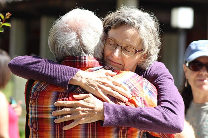Robert Meyer, the husband of Sacramento City College biology professor Virginia Meyer, and Mary Ann Robinson, an employee at the colleges library, hug at the love-in held at the Quad at Sacramento City College on Sept. 4, 2015, the day after a fatal shooting occurred on campus. (Photo by Barbara Harvey)