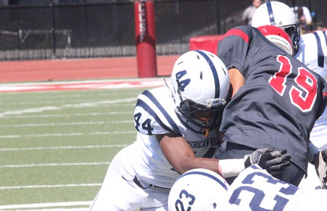 American River College linebacker Jim Carter tackles City College of San Francisco wide receiver Erik Phillip during ARC’s win over CCSF on Sat. Sept. 26, 2015 where ARC pulled out a 20-17 victory. (Photo by Ashlynn Johnson)