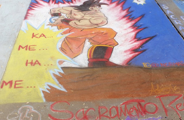 A chalk depiction of Goku from the animated cartoon “Dragon Ball Z” at Chalk It Ups 25th annual art festival on Labor Day weekend in Fremont park, downtown Sacramento. This artist decided to include their contact information for Instagram with their username “IG@NORMAS+EART”. (Photo by Cheyenne Drury)
