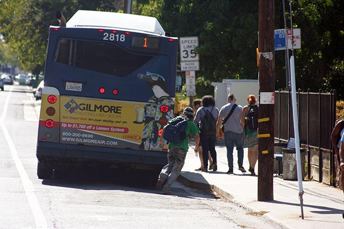 Students walk toward the entrance of the No. 1 Bus on the corner of College Oak Drive and Orange Grove Avenue on Aug. 31, 2015. Measure A, which renewed the universal transit pass, has passed after a vote by Los Rios students on eServices. (Photo by John Ferrannini)