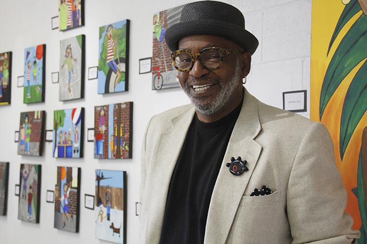 Gerry Otis Simpson, also known as GOS, stands in front of his series Let The Children Play at his studio on Del Paso Boulevard. Simpson, a former ARC visual merchandising professor, hopes that his gallery will reinvigorate the Del Paso art community, which has declined in recent years. (Photo by Barbara Harvey)