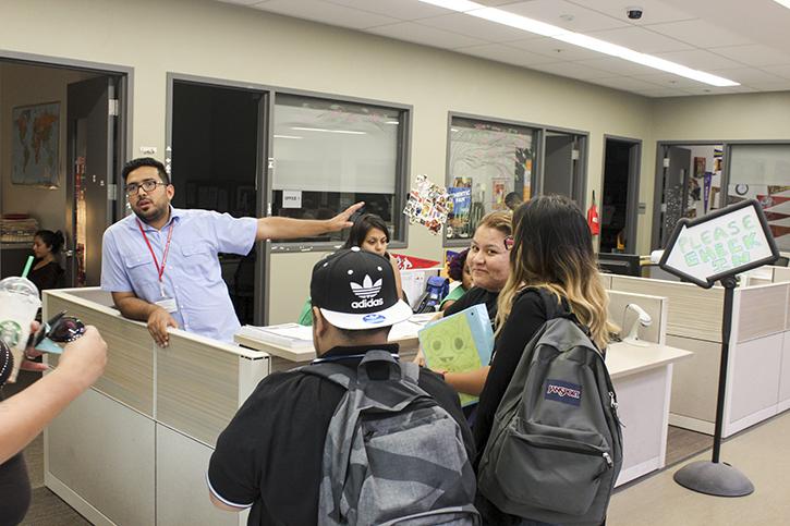 Felipe Gomez, a student personnel assistant in the Journey program, gives students information before they check into the program. The Journey program was given a third of a $3.3 million grant ARC received from the U.S. Department of Education. (Photo by Jordan Schauberger)