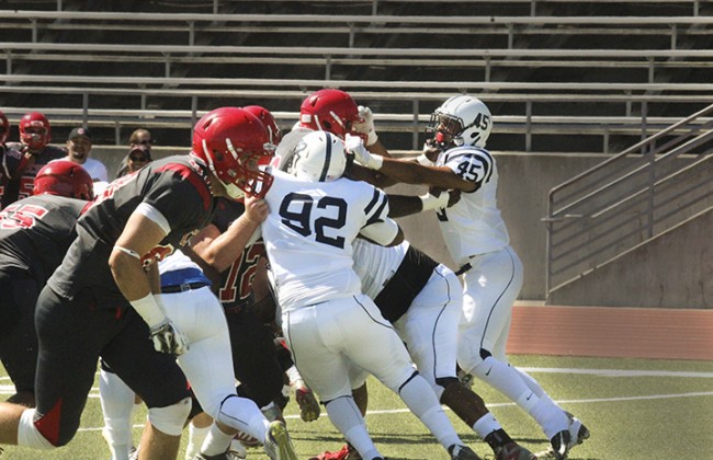 American River College Players collide with players from City College of San Francisco during the game on Sat. Sept. 26 at CCSF.  ARC won against CCSF 20-17. (Photo By Ashlynn Johnson)