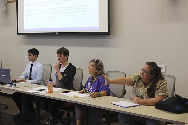 Sen. Tamara Dunning raises her hand to ask a questions during Student Senate’s discussion on campus safety Tuesday. (Photo by Jordan Schauberger)