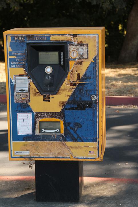 A parking ticket machine in lot A near the automotive department on campus. This one of several malfunctioning machines on campus. (Photo by Nicholas Corey)