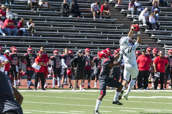 American River College wide receiver Jonathan Lopez goes up high to catch a pass during ARCs 20-17 win over City College of San Francisco at San Francisco on Sept 26, 2015. There were many similarities between ARCs 20-17 and its 17-14 loss to CCSF in the NorCal finals. (photo by Joe Padilla)