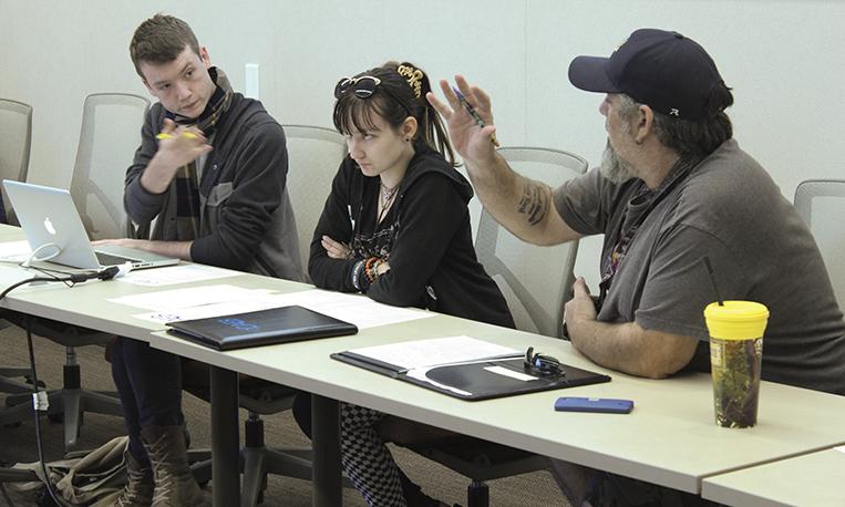 Clubs and Events Board President Justin Nicholson, left, recognizes Director of Communication Bruce Rand for an anthropology club update while Vice President Mary Stedman listens during CAEB’s meeting Tuesday.  